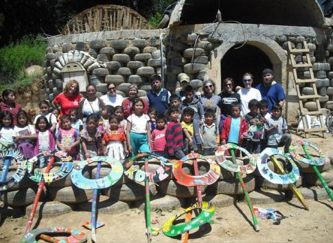 Students and volunteers in front of the school