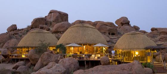 The unique huts of Camp Kipwe at night