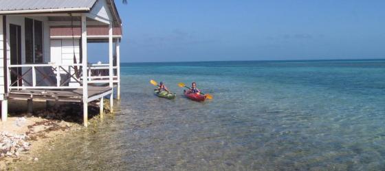 Kayakers set out from Paradise Lodge's "over the water" cabanas