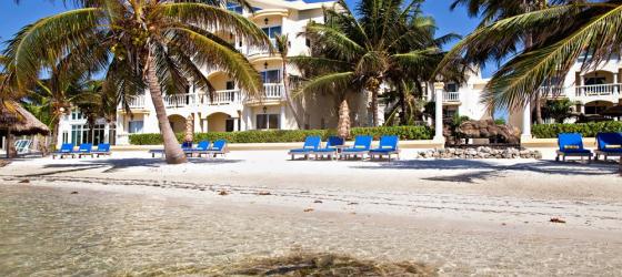 Relax on the large, sunny beach at Pelican Reef Villas