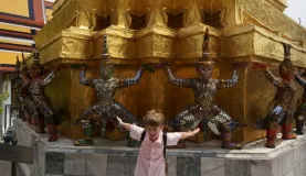 playing around the temple statues