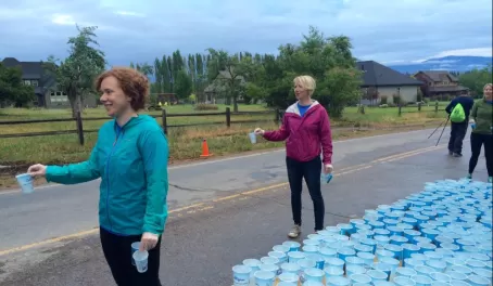 Emily & Laura handing out water