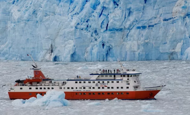 Skorpios III cruising along glaciers