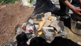 laying out the food on the hot stones