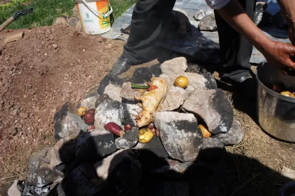 laying out the food on the hot stones