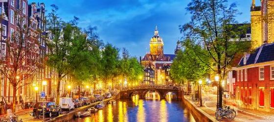 Western Church with water canal view in Amsterdam