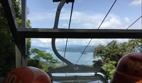 Tram ride up to the zip line with Lake Arenal in the distance