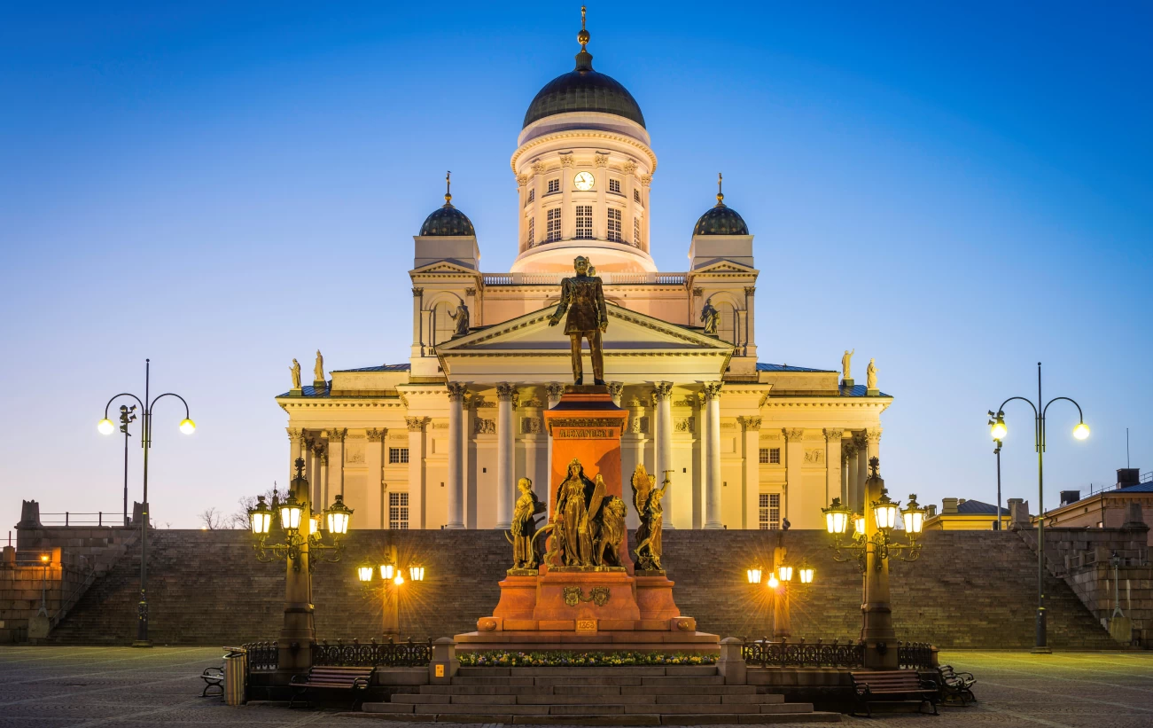 Helsinki Cathedral illuminated at dusk overlooking Senate Square