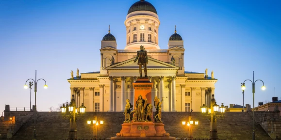 Helsinki Cathedral illuminated at dusk overlooking Senate Square