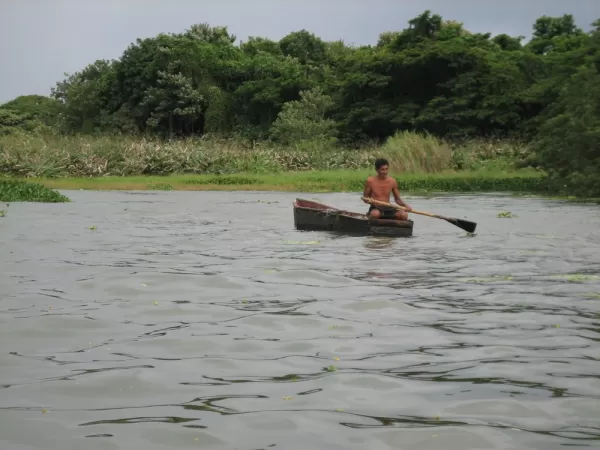 man still rowing his boat