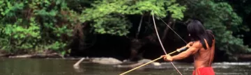 Indigenous man hunting in the Amazon