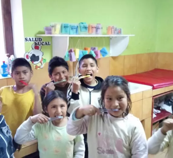Mantay kids brushing their teeth