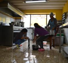 Mantay women washing the kitchen from top to bottom