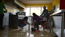 Mantay women washing the kitchen from top to bottom