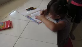 One child dives right into the coloring book