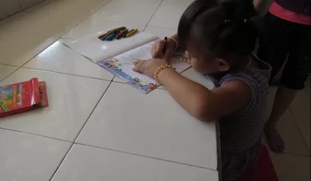 One child dives right into the coloring book