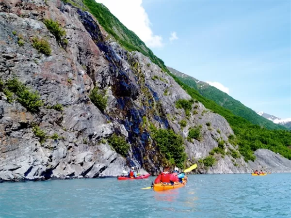 Kayaking along stunning cliffs