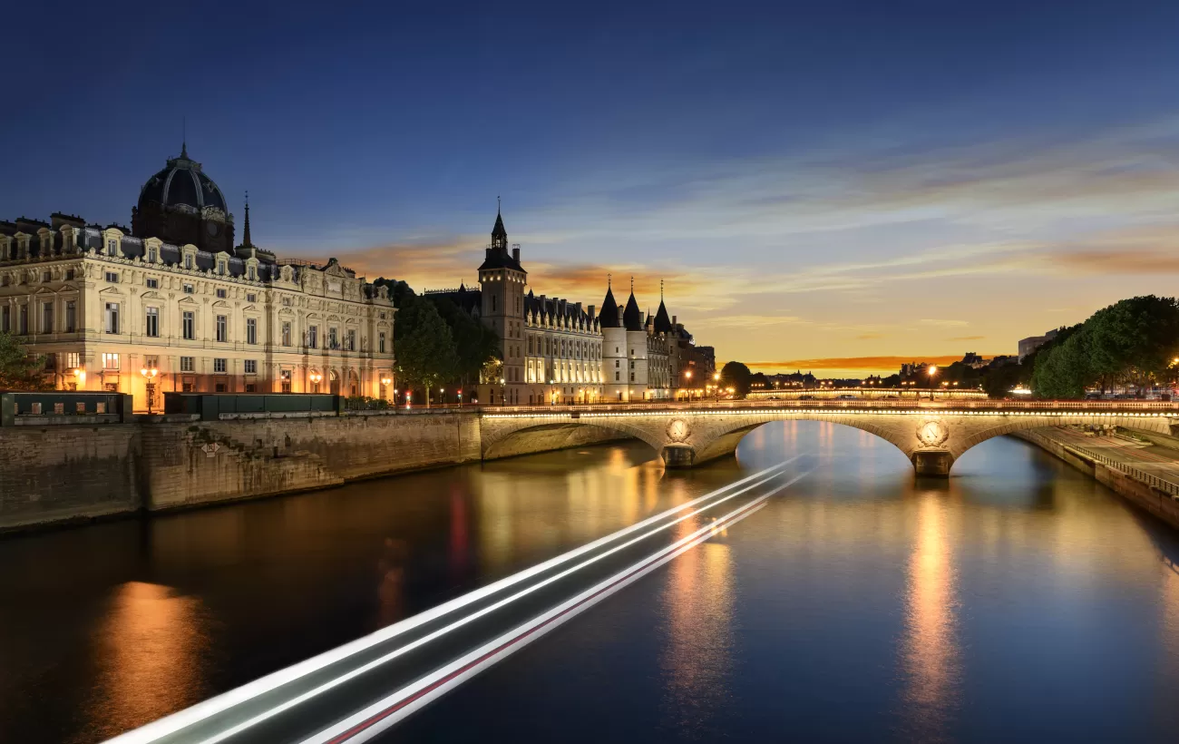 Touring on Seine river in Paris with sunset