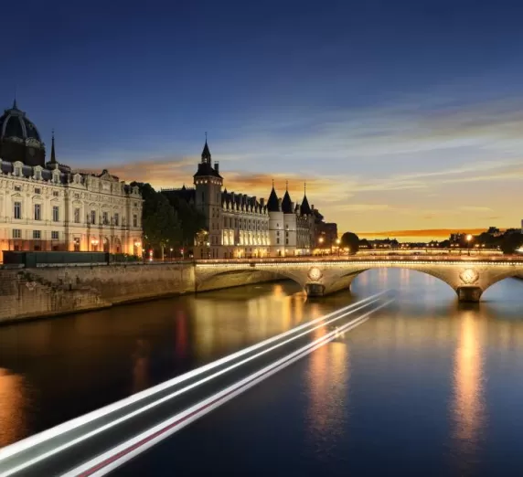 Touring on Seine river in Paris with sunset