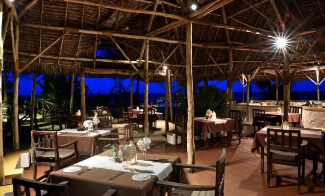 Gather in the dining area for a delicious meal of local Zanzibar cuisine