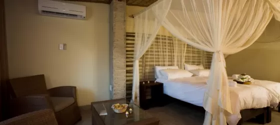 Settle into your comfortable bedroom at Okaukuejo Resort