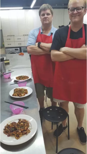 The proud makers of Kung Pao chicken in a cooking class in Shanghai
