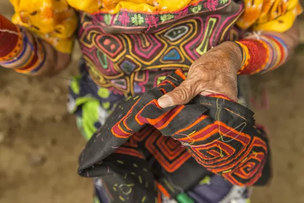 A Kuna Yala woman sews a traditional garment.