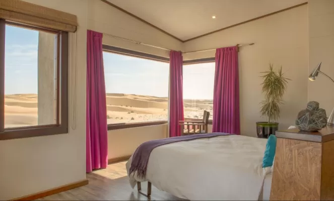 Wake up to sweeping views of the Namibian desert