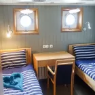 Twin bed with portholes