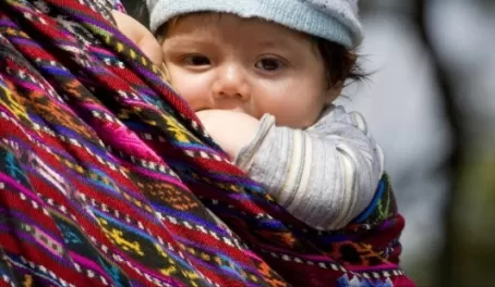 Infant in a sling pack