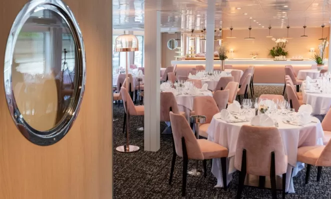 Enjoy fine dining and great conversation in the dining room aboard MS Renoir