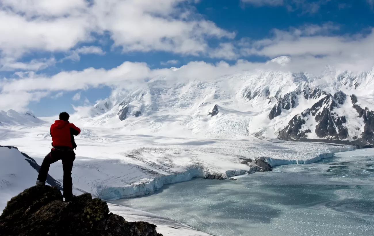 Hiking to a summit with views of the glaciers below