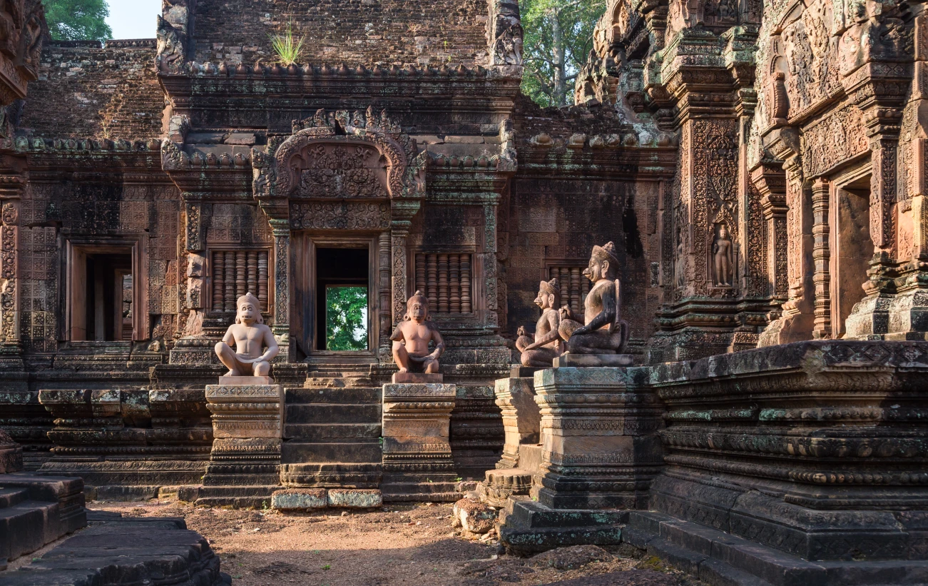 Statues and intricate relief carvings inside Angkor Wat