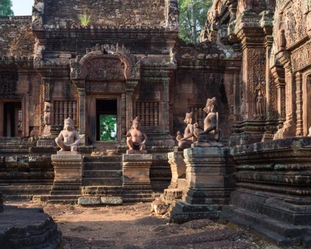 Statues and intricate relief carvings inside Angkor Wat