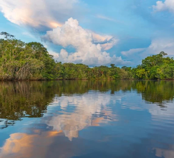 Sunset over the still waters of the Amazon