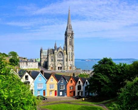 Colorful row houses and the soaring cathedral of Cork