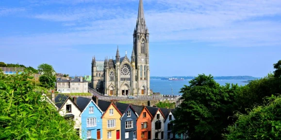 Colorful row houses and the soaring cathedral of Cork