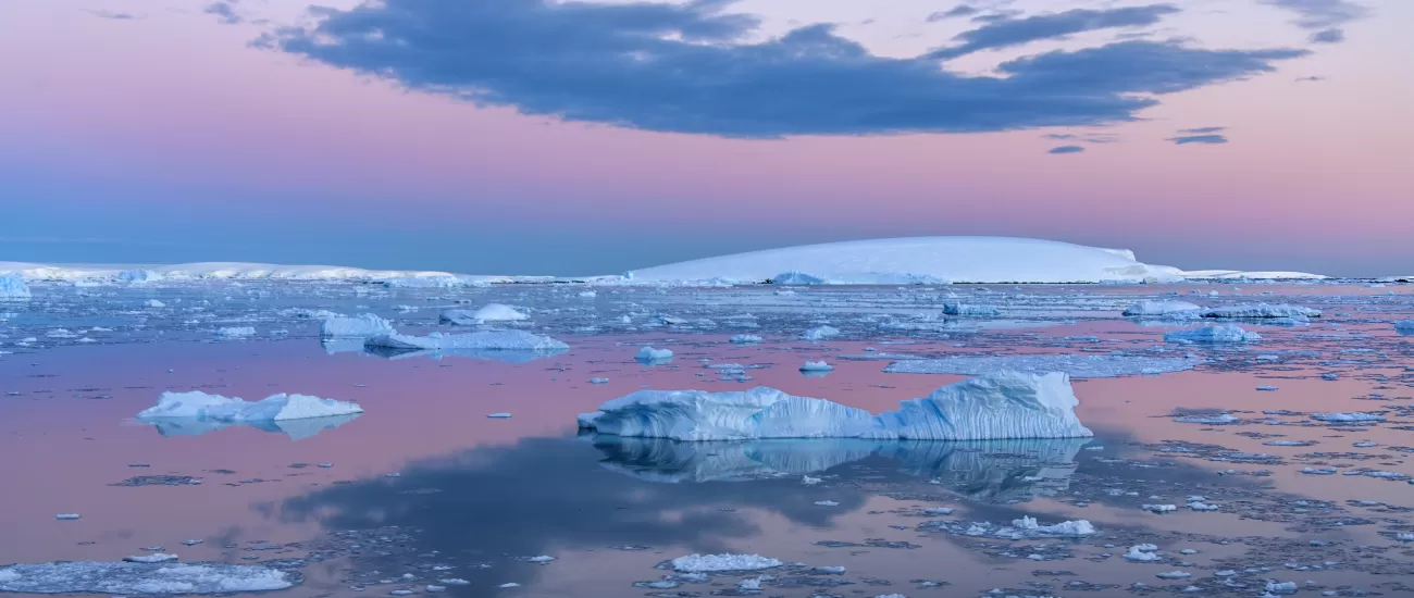 Midnight sun over the flat-topped icebergs of the Weddell Sea