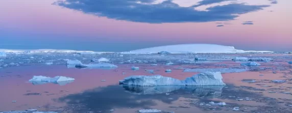 Midnight sun over the flat-topped icebergs of the Weddell Sea