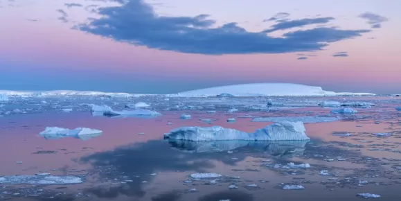Midnight sun over the flat-topped icebergs of the Weddell Sea