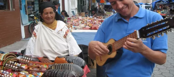 Playing a charango at the local market in Otavalo, Ecuador