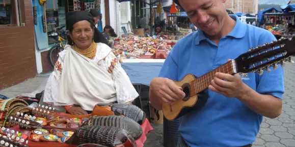 Playing a charango at the local market in Otavalo, Ecuador