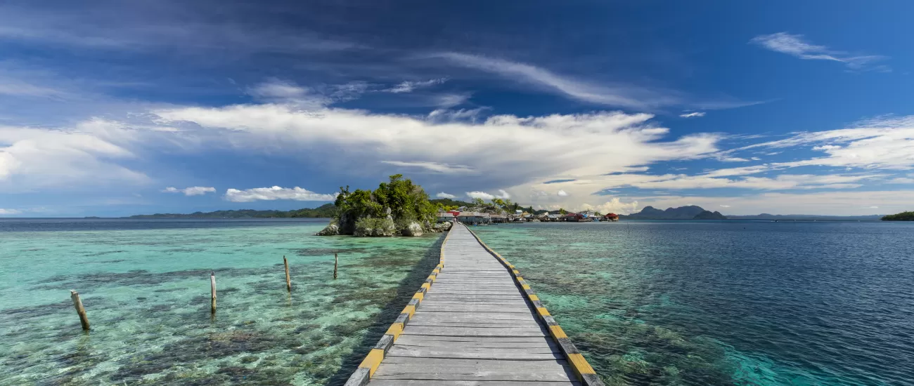 Walk out over the crystal clear waters of Indonesia
