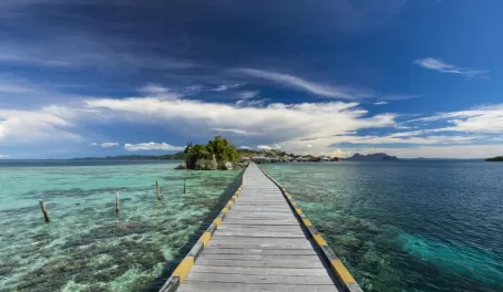Walk out over the crystal clear waters of Indonesia