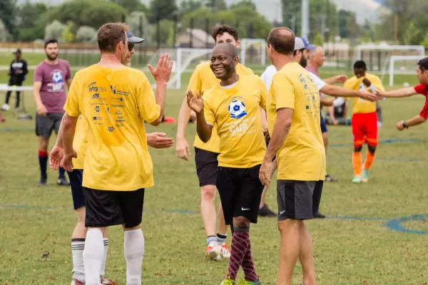 Soccer tournament participants congratulate each other on a good game