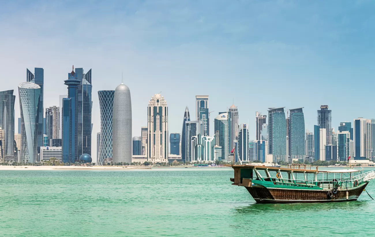 Look for traditional dhow boats sailing near Doha