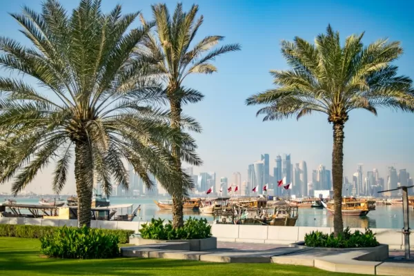 Enjoy a walk through a park in sunny Doha