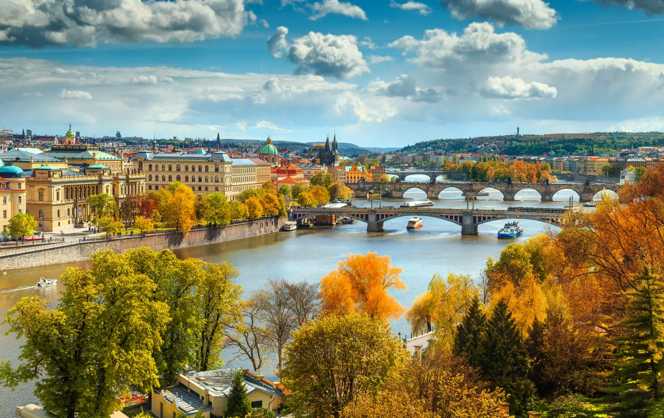 An autumn view across the Vltava river to old town Prague