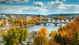 An autumn view across the Vltava river to old town Prague