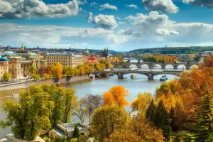 An autumn view across the Vltava river to old town Prague